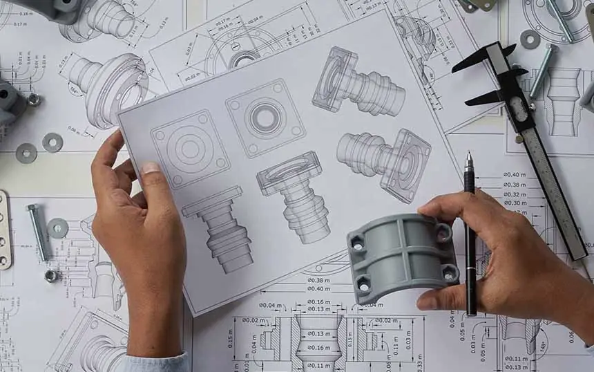 Engineer reviewing a structural steel drawing at a desk