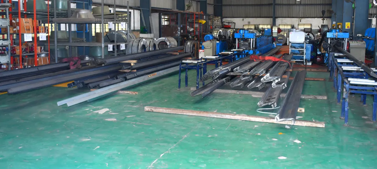 Purlins and roofing sheets stacked for dispatch on the shop floor at the Khushkhera plant