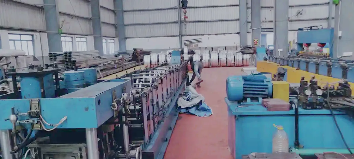 Roll-forming line at the Khushkhera plant, not a photograph of the Lenskart site